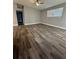 Spacious living room featuring wood-look flooring and a ceiling fan at 1541 N Hudson St, Orlando, FL 32808