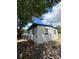 White house exterior with black accents, surrounded by lush trees at 1541 N Hudson St, Orlando, FL 32808