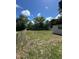 Large backyard with a chain link fence at 1541 N Hudson St, Orlando, FL 32808