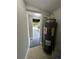 Laundry room with water heater and built-in shelving at 1541 N Hudson St, Orlando, FL 32808