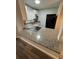Modern kitchen with granite countertops and stainless steel appliances at 1541 N Hudson St, Orlando, FL 32808