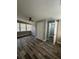 Spacious bedroom with wood-look floors and a double-door closet at 1541 N Hudson St, Orlando, FL 32808