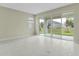 Gathering room with sliding glass doors leading to backyard at 171 Bull Frog Ln, Umatilla, FL 32784