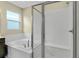 Bathroom with soaking tub and a separate walk-in shower at 171 Bull Frog Ln, Umatilla, FL 32784