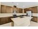 Modern kitchen featuring island, stainless steel appliances, and ample cabinetry at 171 Bull Frog Ln, Umatilla, FL 32784