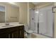 Bathroom with single vanity and walk-in shower at 171 Bull Frog Ln, Umatilla, FL 32784