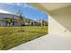 Covered patio overlooking a grassy backyard at 171 Bull Frog Ln, Umatilla, FL 32784