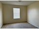 Spacious bedroom with neutral walls and window blinds at 624 Cresting Oak Cir # 32, Orlando, FL 32824