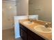 Bathroom with double sinks and a tub at 624 Cresting Oak Cir # 32, Orlando, FL 32824