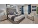 Main bedroom with plush king bed and sitting area at 1770 Sawyer Palm Pl, Kissimmee, FL 34747