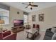 Living room features a TV, comfy seating, and a coffee table at 1770 Sawyer Palm Pl, Kissimmee, FL 34747