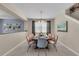 Elegant dining room with a large table and comfortable seating for eight at 1770 Sawyer Palm Pl, Kissimmee, FL 34747