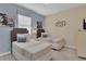Bedroom with two twin beds, nightstands, and wall art at 1770 Sawyer Palm Pl, Kissimmee, FL 34747