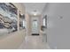 Bright and airy entryway with tile flooring and modern wall art at 1770 Sawyer Palm Pl, Kissimmee, FL 34747