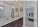 Bathroom with double vanity and view of bedroom at 1770 Sawyer Palm Pl, Kissimmee, FL 34747