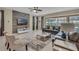 Living room with a cozy seating arrangement and a wood-look accent wall at 1770 Sawyer Palm Pl, Kissimmee, FL 34747