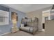 Bedroom with bunk beds, nightstand, and access to a bathroom at 1770 Sawyer Palm Pl, Kissimmee, FL 34747