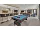 Fun game room with a pool table and views into the living area at 1770 Sawyer Palm Pl, Kissimmee, FL 34747
