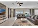 Spacious living room with large windows, sliding glass doors, and comfortable seating at 1770 Sawyer Palm Pl, Kissimmee, FL 34747