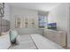 King-size bed in a bright bedroom with TV and dresser at 1754 Caribbean View Ter, Kissimmee, FL 34747