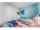 Two twin beds in a Frozen-themed bedroom with TV at 1754 Caribbean View Ter, Kissimmee, FL 34747