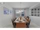 Elegant dining room with a large wooden table and comfortable seating for eight at 1754 Caribbean View Ter, Kissimmee, FL 34747