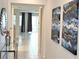 Bright and airy entryway with tile flooring, a glass-top console table, and modern wall art at 1754 Caribbean View Ter, Kissimmee, FL 34747