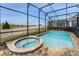 Relaxing pool and jacuzzi with a fenced backyard and open space at 1754 Caribbean View Ter, Kissimmee, FL 34747