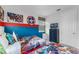 bedroom with twin beds, superhero themed bedding, and a dresser at 1754 Caribbean View Ter, Kissimmee, FL 34747
