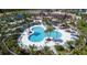 Large community pool with surrounding lounge chairs and landscaping at 1754 Caribbean View Ter, Kissimmee, FL 34747