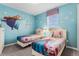 Two twin beds in a Frozen-themed bedroom at 1754 Caribbean View Ter, Kissimmee, FL 34747