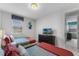 Two twin beds in an Alice in Wonderland bedroom with TV at 1754 Caribbean View Ter, Kissimmee, FL 34747