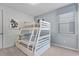 Bunk beds in a well-lit bedroom with themed decor at 1754 Caribbean View Ter, Kissimmee, FL 34747