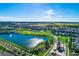 Community overview showcasing homes, landscaping, and a lake at 1754 Caribbean View Ter, Kissimmee, FL 34747