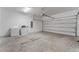 Garage with washer and dryer, and an automatic garage door at 1754 Caribbean View Ter, Kissimmee, FL 34747