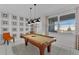 Fun game room with a pool table and two accent chairs at 1754 Caribbean View Ter, Kissimmee, FL 34747