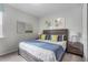 King-size bed in a bedroom with calm decor at 1754 Caribbean View Ter, Kissimmee, FL 34747