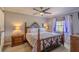 Spacious main bedroom with a king-size bed and ensuite bathroom at 720 Shore Drive, Kissimmee, FL 34744