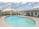 Inviting screened pool area with spacious deck at 720 Shore Drive, Kissimmee, FL 34744