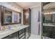 Elegant bathroom with double vanity and a large walk-in shower at 720 Shore Drive, Kissimmee, FL 34744