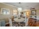 Charming dining room with hardwood floors and seating for four at 720 Shore Drive, Kissimmee, FL 34744