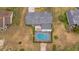 Overhead view showcasing the home, pool, and surrounding landscape at 720 Shore Drive, Kissimmee, FL 34744