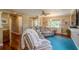 Living room with hardwood floors, sectional sofa, and a cozy atmosphere at 720 Shore Drive, Kissimmee, FL 34744