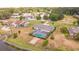 Aerial view of a single-Gathering home with a private pool and a large backyard, located near a canal at 720 Shore Drive, Kissimmee, FL 34744