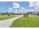 Charming ranch home with a well-maintained lawn and long driveway at 720 Shore Drive, Kissimmee, FL 34744