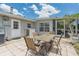 Outdoor patio with table and chairs at 720 Shore Drive, Kissimmee, FL 34744