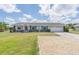 Ranch style home with landscaped yard at 720 Shore Drive, Kissimmee, FL 34744