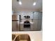 Modern kitchen featuring stainless steel appliances and ample cabinetry at 714 Siena Palm Dr # 203, Celebration, FL 34747