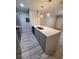 Modern kitchen with island and stainless steel appliances at 714 Siena Palm Dr # 203, Celebration, FL 34747