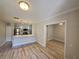Open concept living area with kitchen and wood-look floors at 714 Siena Palm Dr # 203, Celebration, FL 34747